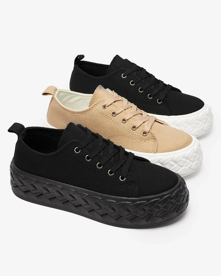 Schwarze Sport-Sneakers auf einem Plateau Saddol- Footwear