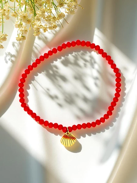 Royalfashion Damenarmband mit Muschelanhänger