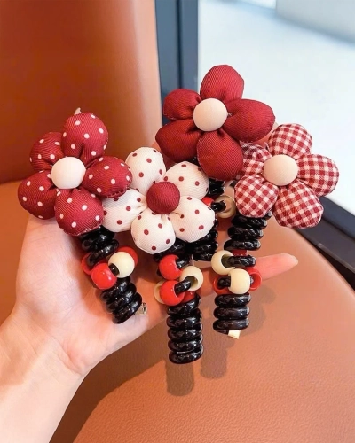 Royalfashion Haargummi Spirale mit kleiner Blume Blossom Coil