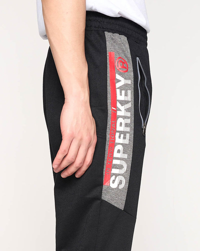 Schwarze Herren-Jogginghose mit Aufschriften - Kleidung