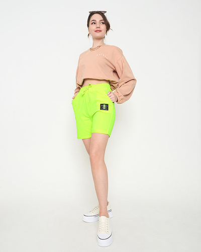 Neongelbe Damen-Shorts oberhalb des Knies - Kleidung