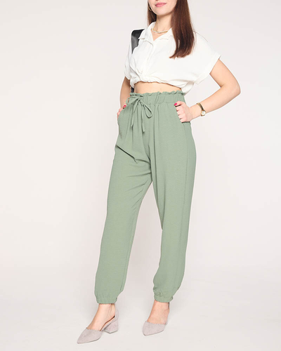 Жіночі тканинні штани зеленого кольору PLUS SIZE - Одяг