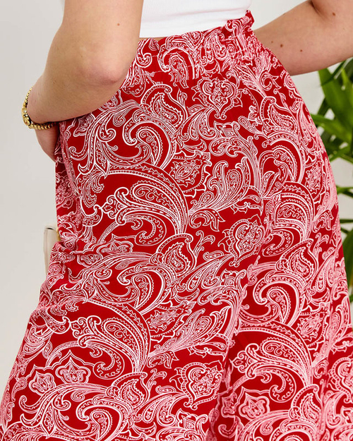 Червоні жіночі тканинні штани з принтом - Одяг