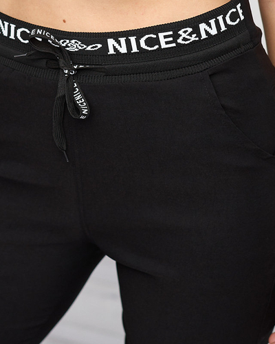 Schwarze Trainingsanzüge für Damen mit weißen Aufschriften - Kleidung