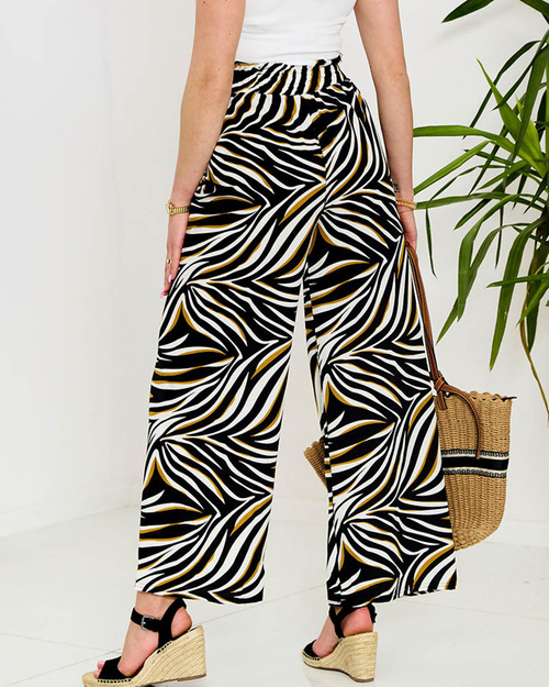 Візерункові жіночі брюки палаццо чорного кольору - Одяг