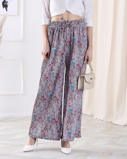 Жіночі брюки з візерунком на широких штанинах синього кольору - Одяг