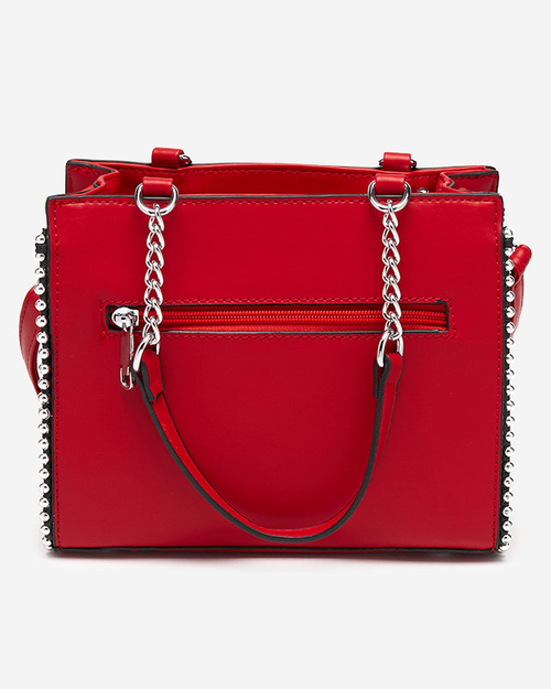 Червона жіноча сумочка з плетеною вставкою