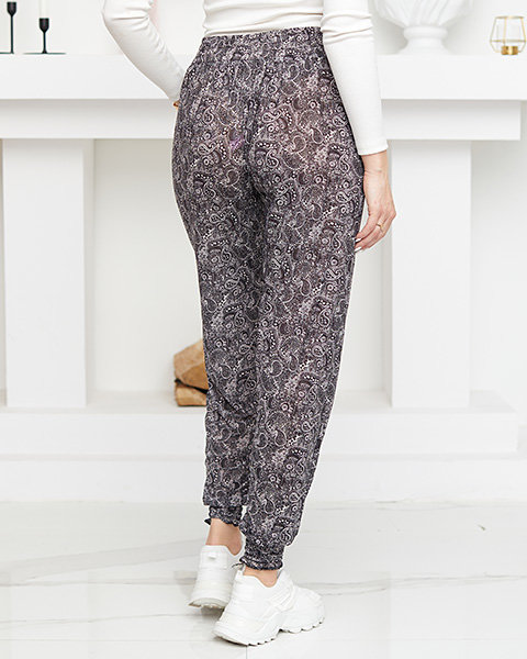 Чорно-білі жіночі штани з малюнком - Одяг