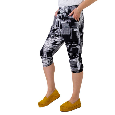 Чорні жіночі штани 3/4 PLUS SIZE з малюнком - Одяг