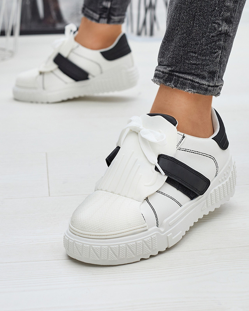 Чорно-білі жіночі спортивні кросівки з гумовими вставками Inika - Взуття