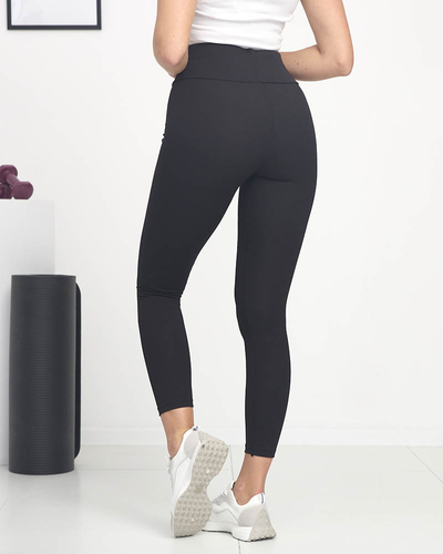 Schwarz gestreifte Damen-Leggings mit grünen Zeichen - Bekleidung