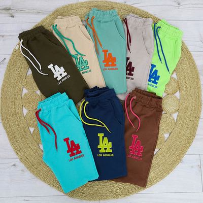 Dunkelgrüne Damen-Jogginghose mit farbigem Aufnäher - Kleidung