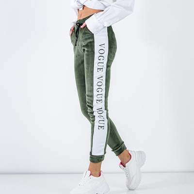 Зелені жіночі утеплені спортивні штани лампасами - Одяг