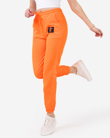 Неонові помаранчеві жіночі спортивні штани