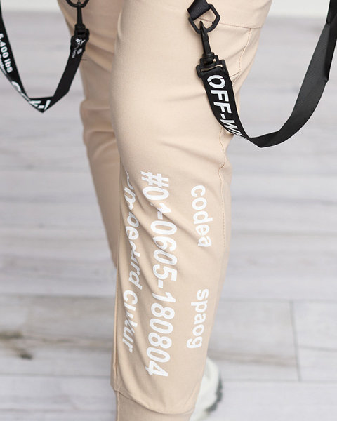 Бежеві жіночі штани з написами