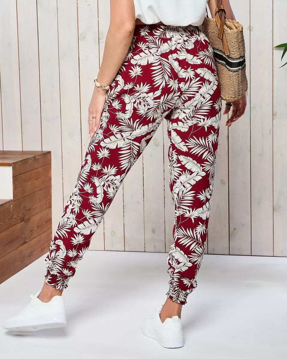 Бордові жіночі брюки з тканини а-ля алладін з квітковим візерунком - Одяг