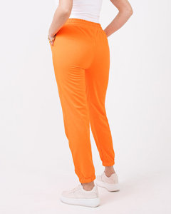Неонові помаранчеві жіночі спортивні штани