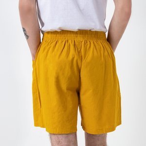 Жовті чоловічі короткі шорти з кишенями